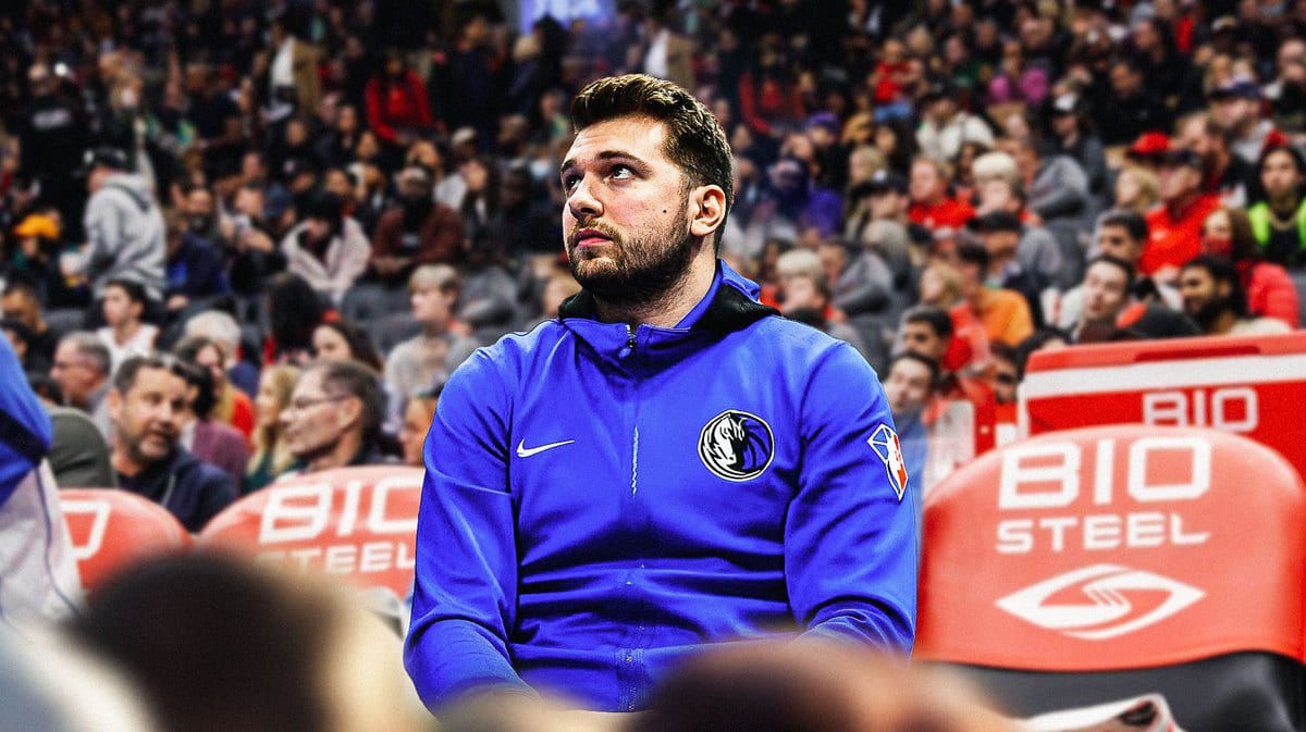 Need Mavericks' Luka Doncic sitting down on an NBA sideline looking serious.
