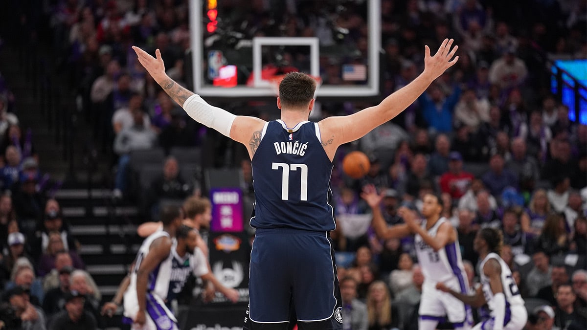 Dallas Mavericks guard Luka Doncic (77) raises his arms during action against the Sacramento Kings in the third quarter at the Golden 1 Center. 