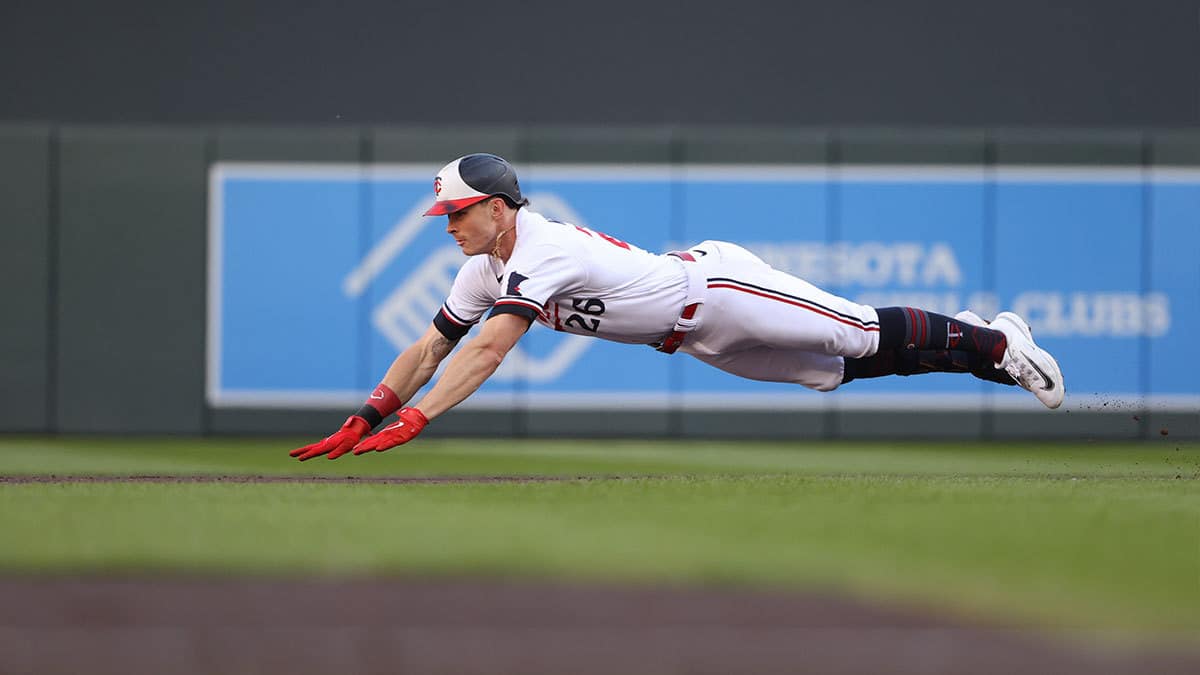 Minnesota Twins right fielder Max Kepler (26) dives into second base in the first inning against the Houston Astros during game three of the ALDS for the 2023 MLB playoffs at Target Field.