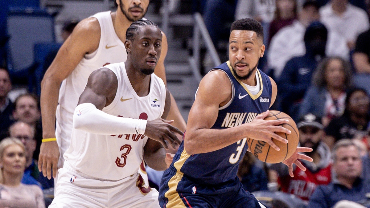 New Orleans Pelicans guard CJ McCollum (3) dribbles against Cleveland Cavaliers guard Caris LeVert (3) during the first half at Smoothie King Center