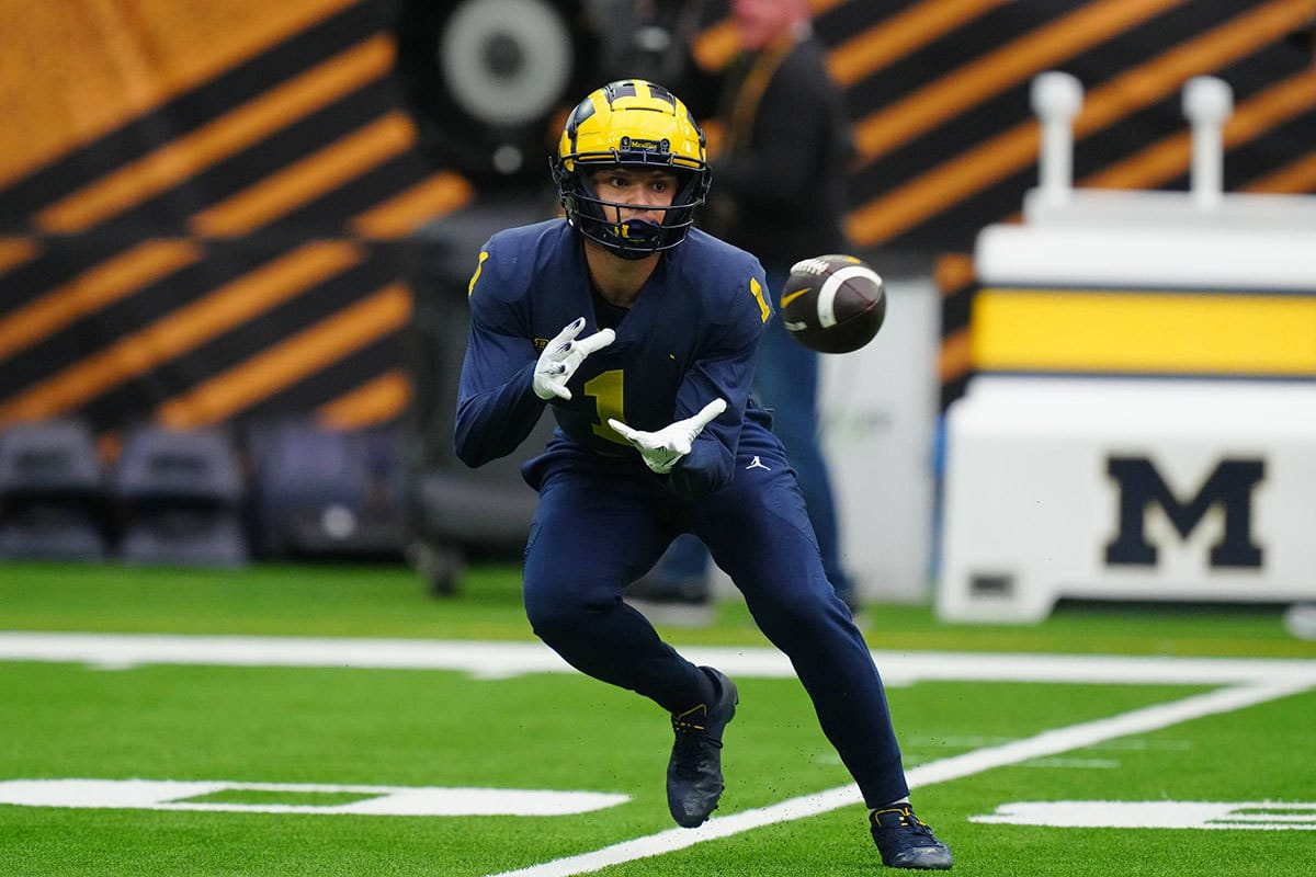 Michigan Wolverines wide receiver Roman Wilson (1) catches the ball during a practice session before the College Football Playoff national championship game against the Washington Huskies at NRG Stadium. 