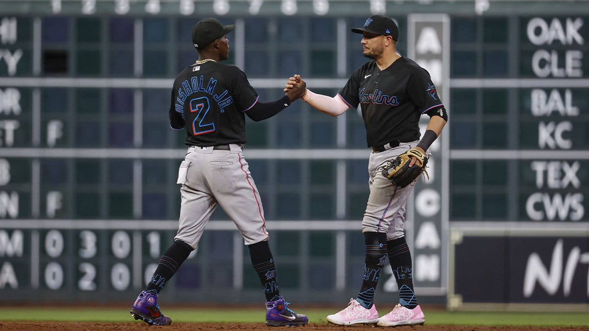 Miami Marlins second baseman Jazz Chisholm Jr. (2) celebrates with shortstop Miguel Rojas (11) after the Marlins defeated the Houston Astros at Minute Maid Park.