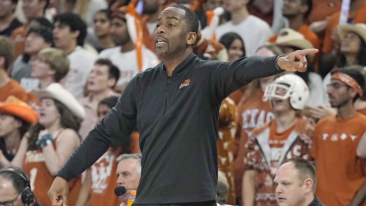 Oklahoma State Cowboys head coach Mike Boynton signals to players during the second half against the Texas Longhorns at Moody Center