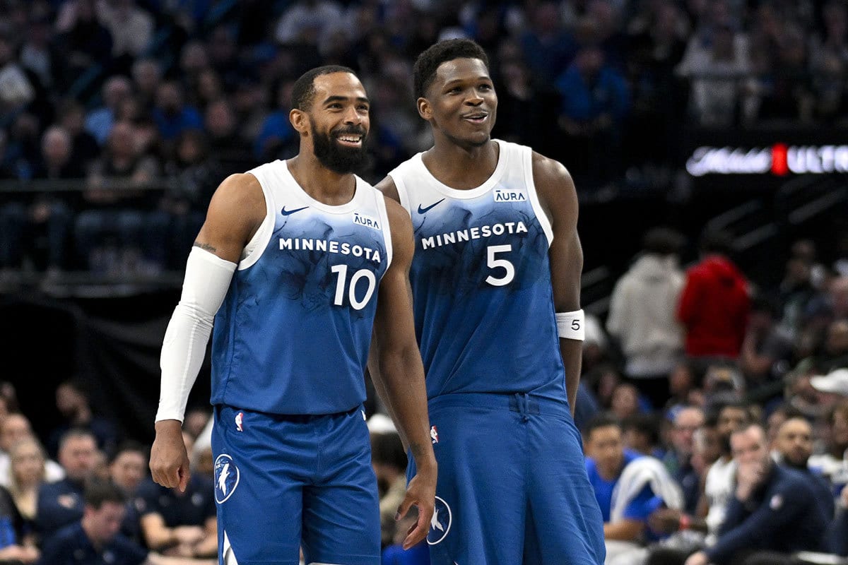 Minnesota Timberwolves guard Mike Conley (10) and guard Anthony Edwards (5) smile during in a stopped in play against the Dallas Mavericks during the second quarter at the American Airlines Center.