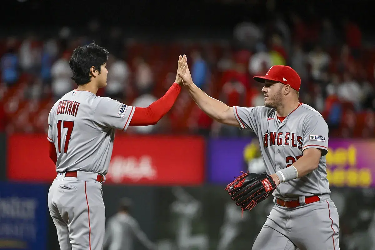 Los Angeles Angels starting pitcher Shohei Ohtani (17) and center fielder Mike Trout (27) celebrate after the Angels defeated the St. Louis Cardinals at Busch Stadium