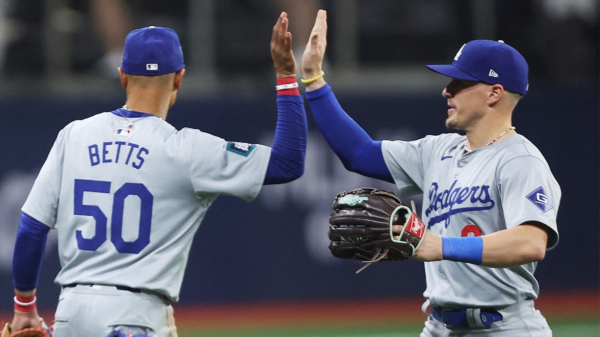 Seoul, SOUTH KOREA; Los Angeles Dodgers players Mookie Betts and Enrique Hernandez celebrate after defeating the San Diego Padres during a MLB regular season Seoul Series game at Gocheok Sky Dome.