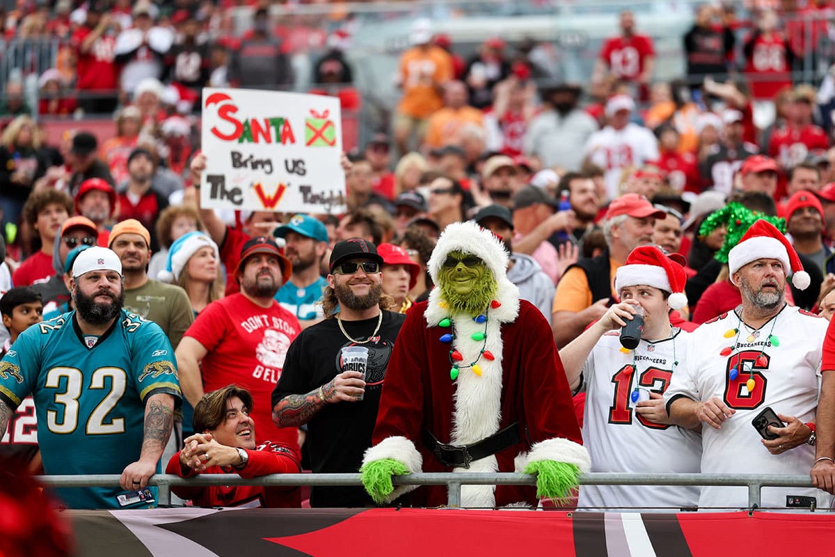 fans watch a game between the Jacksonville Jaguars and Tampa Bay Buccaneers on Christmas Eve at Raymond James Stadium.