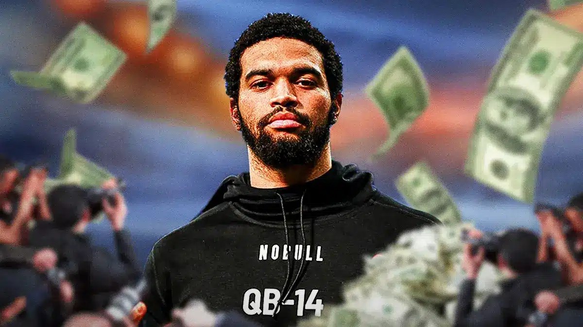 USC quarterback Caleb Williams with money all around him and cameras flashing