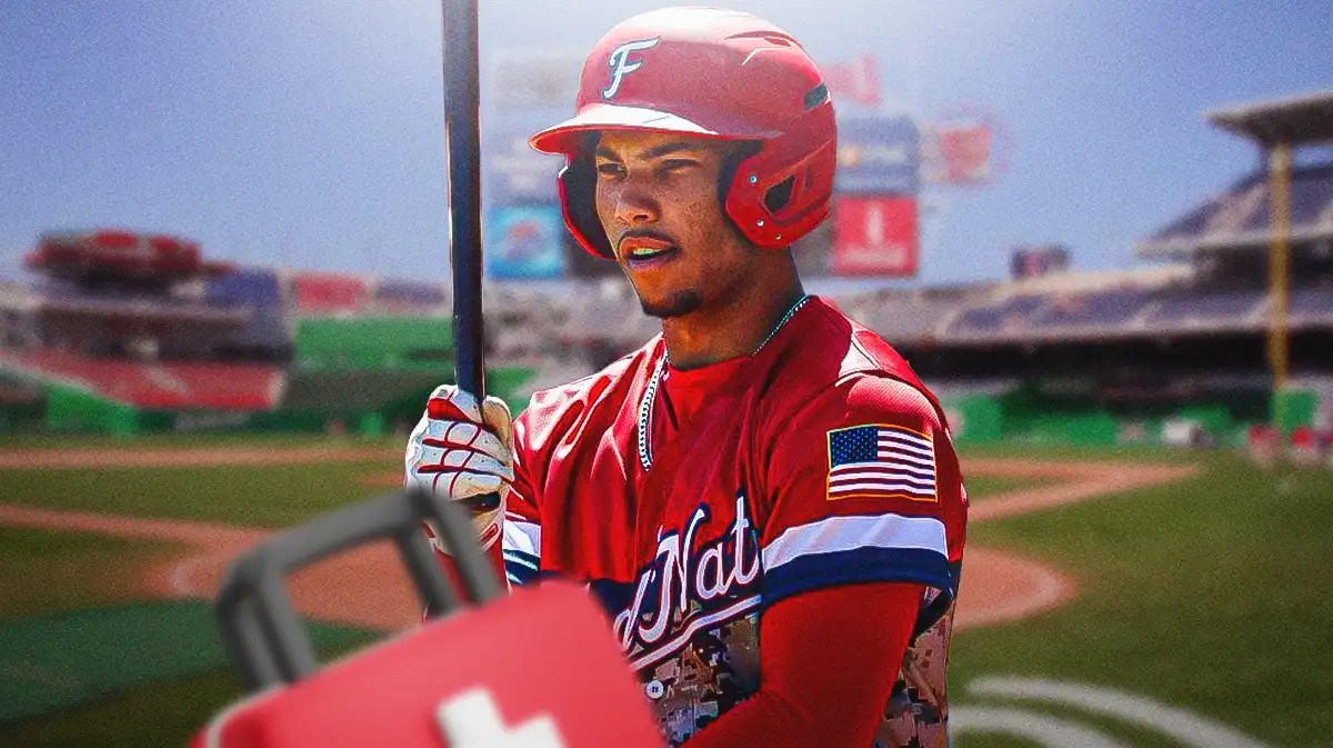 Washington Nationals Daylen Lile with a medical bag on him.
