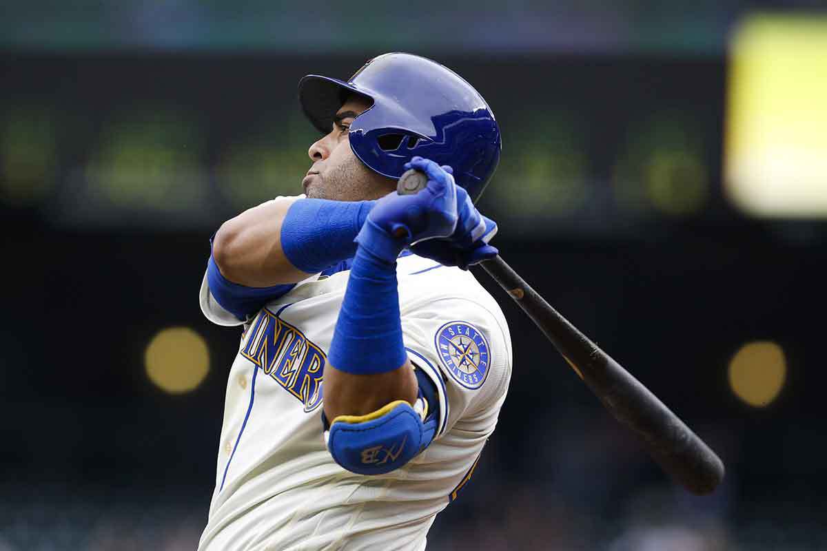 Sep 30, 2018; Seattle, WA, USA; Seattle Mariners right fielder Nelson Cruz (23) takes a warm-up swing before coming up to bat against the Texas Rangers during the first inning at Safeco Field.