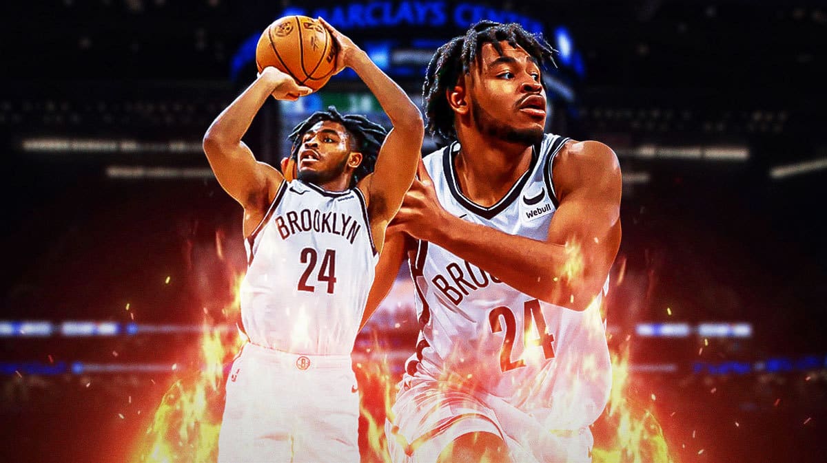 Photo: Cam Thomas in Nets jersey in action with fire around him