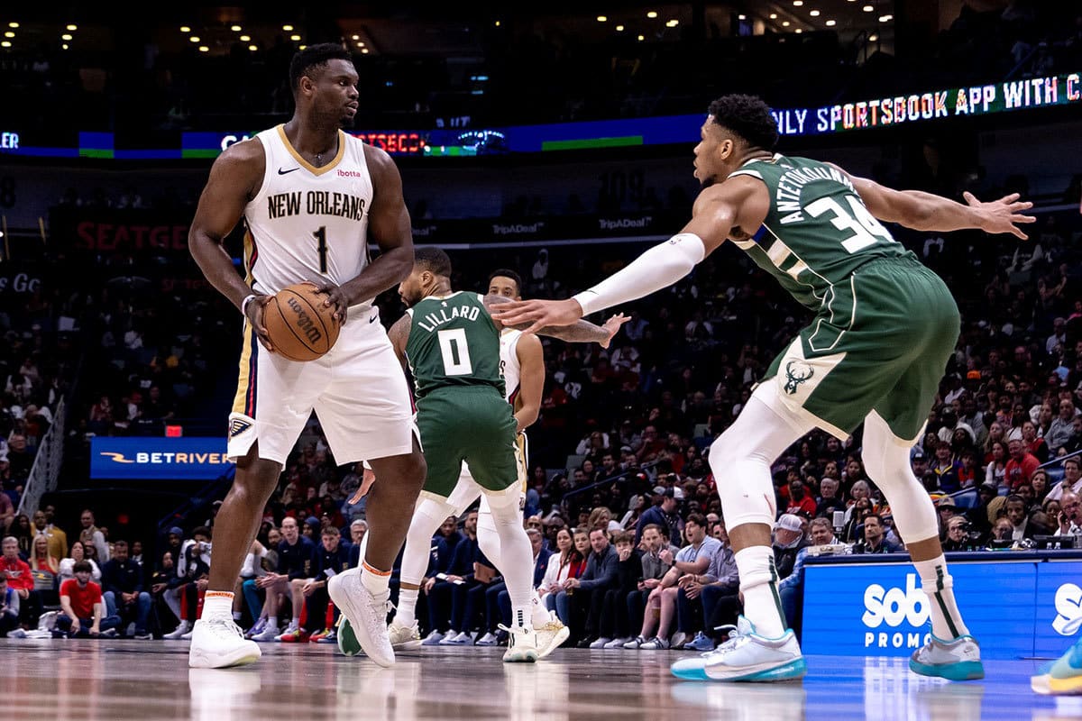 New Orleans Pelicans forward Zion Williamson (1) looks to pass the ball against Milwaukee Bucks forward Giannis Antetokounmpo (34) during the second half at Smoothie King Center. 