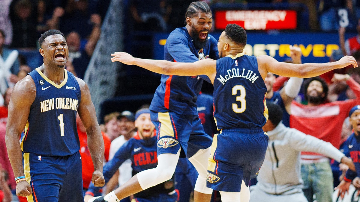 New Orleans Pelicans forward Zion Williamson (1) reacts to a dunk by guard CJ McCollum (3) during the third quarter against the Phoenix Suns at Smoothie King Center. 