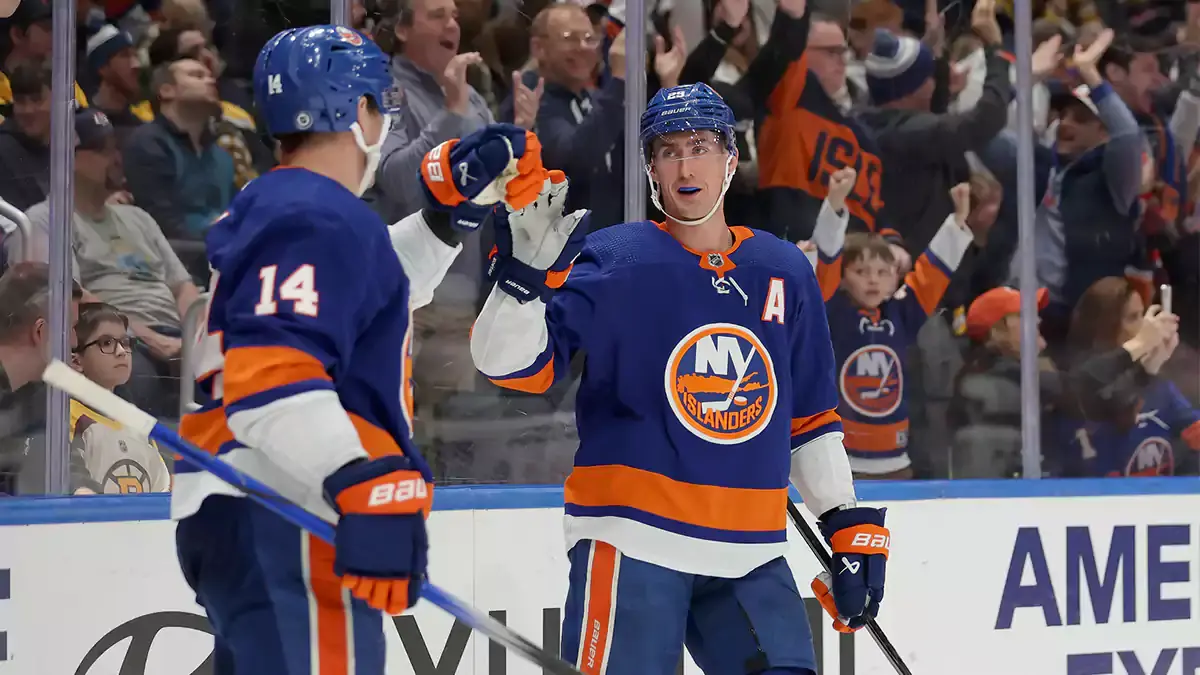 New York Islanders center Brock Nelson (29) celebrates his goal against the Boston Bruins with center Bo Horvat (14) during the second period at UBS Arena
