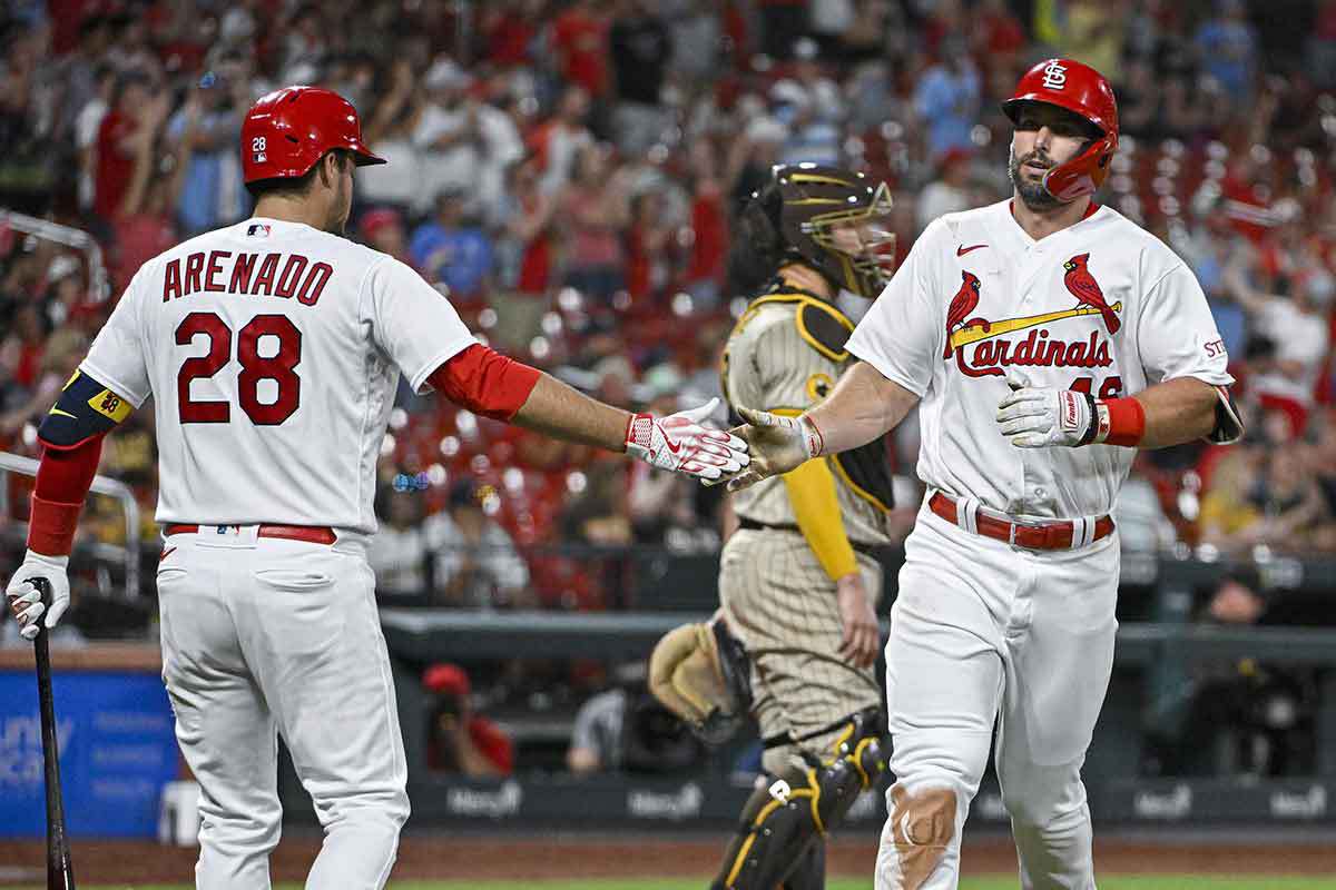 St. Louis Cardinals first baseman Paul Goldschmidt (46) is congratulated by third baseman Nolan Arenado (28) after hitting a solo home run against the San Diego Padres during the eighth inning at Busch Stadium.