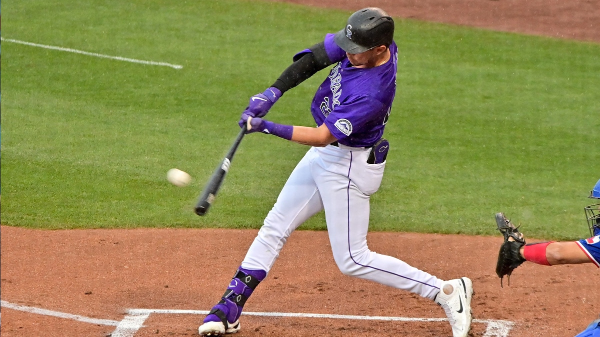 Colorado Rockies right fielder Nolan Jones (22) hits a solo home run in the first inning against the Texas Rangers during a spring training game at Salt River Fields at Talking Stick. 