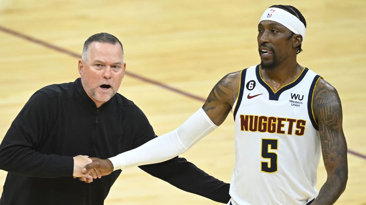 Denver Nuggets head coach Michael Malone and guard Kentavious Caldwell-Pope (5) celebrate in the fourth quarter against the Cleveland Cavaliers at Rocket Mortgage FieldHouse.