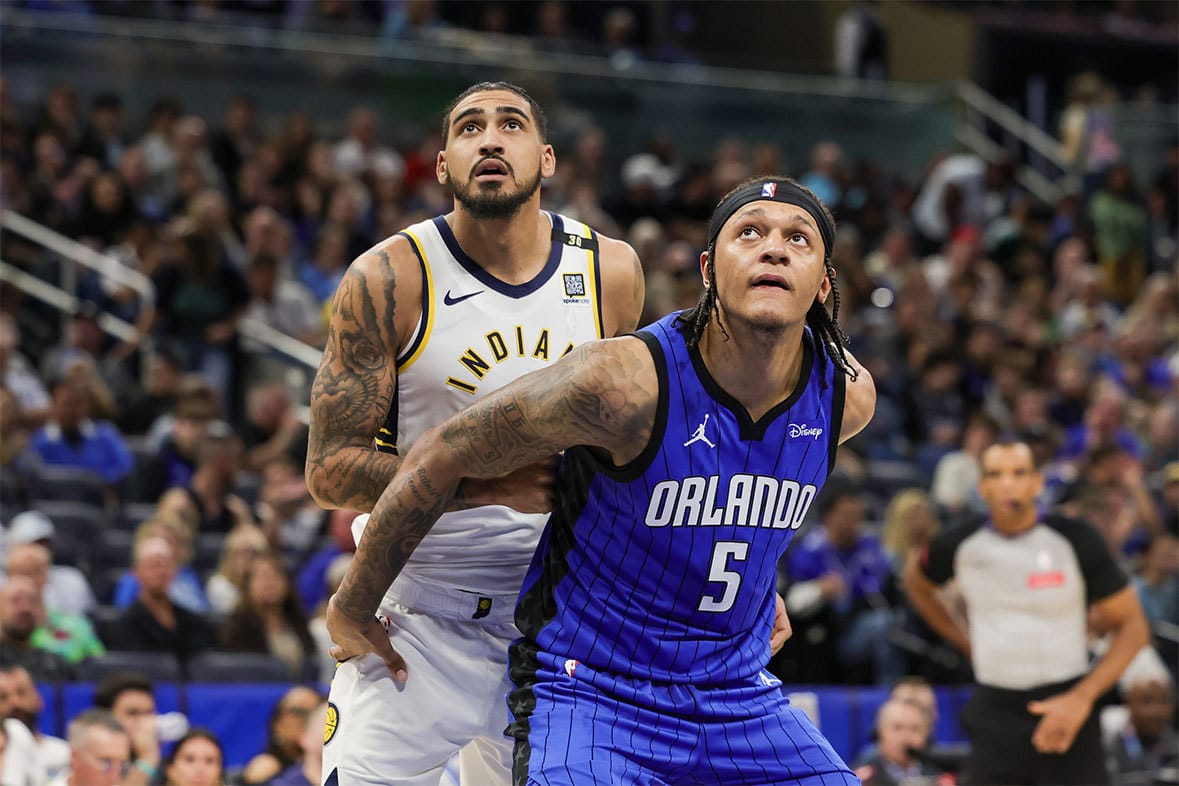 Orlando Magic forward Paolo Banchero (5) and Indiana Pacers forward Obi Toppin (1) look for the rebound during the second half at KIA Center. 