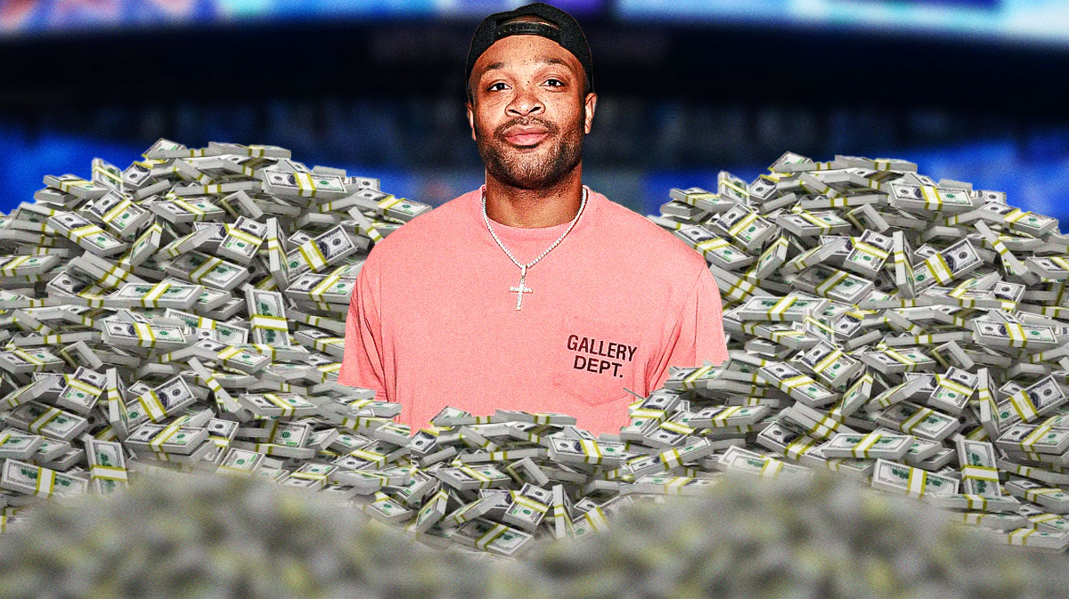 P.J. Tucker surrounded by piles of cash.