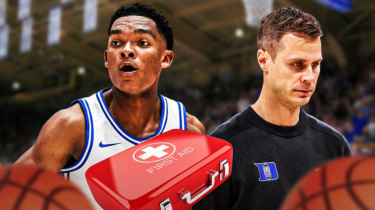 Duke basketball coach Jon Scheyer and Caleb Foster looking sad.