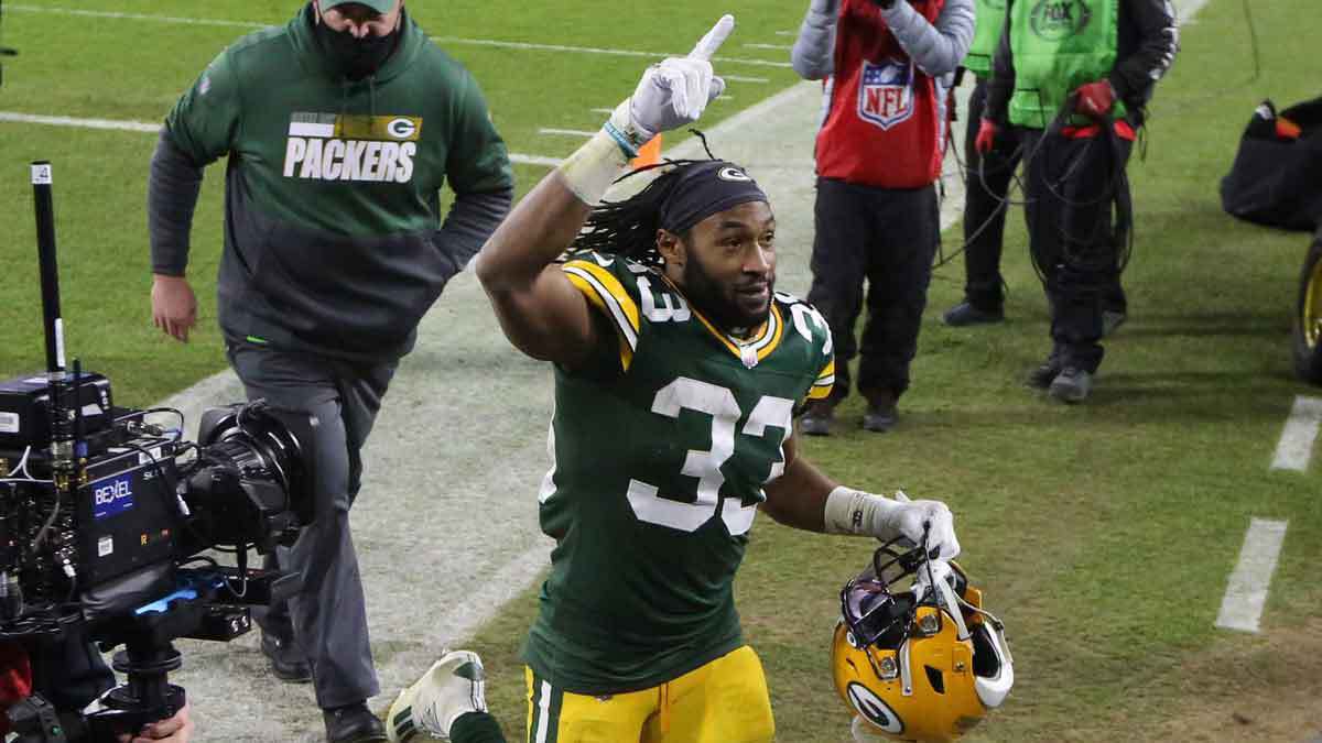 Green Bay Packers running back Aaron Jones (33) acknowledges the fans after the 32-18 win over the Los Angeles Rams during the NFC divisional playoff game Saturday, Jan. 16, 2021, at Lambeau Field in Green Bay, Wis