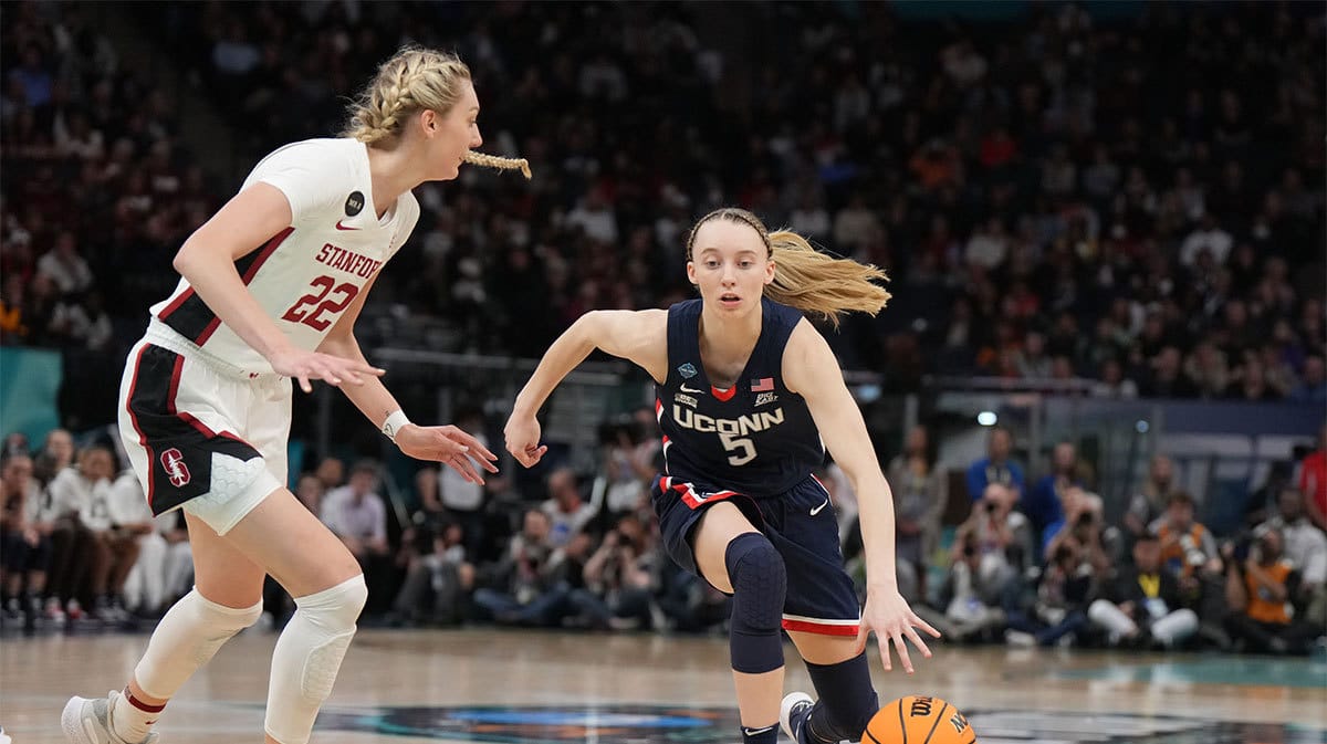 UConn Huskies guard Paige Bueckers (5) dribbles the ball as Stanford Cardinal forward Cameron Brink (22) during the first half in the Final Four semifinals of the women's college basketball NCAA Tournament