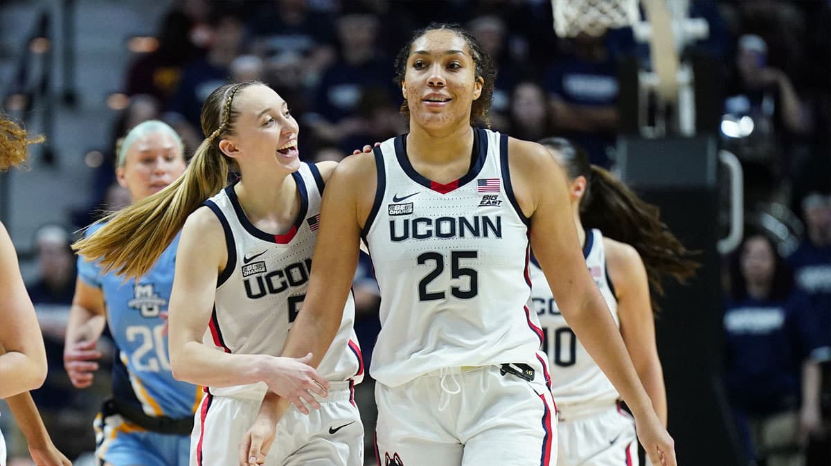 UConn Huskies guard Paige Bueckers (5) reacts with forward Ice Brady (25) after a play against the Marquette Golden Eagles i