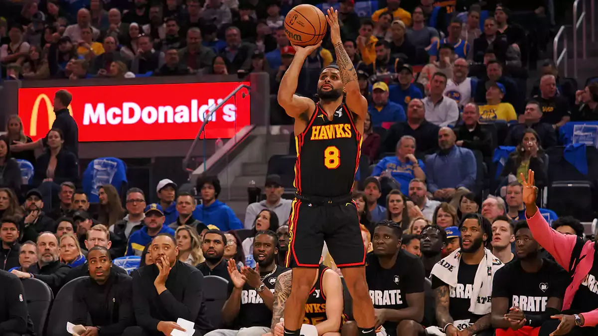 Atlanta Hawks guard Patty Mills (8) scores a three point basket against the Golden State Warriors during the second quarter at Chase Center