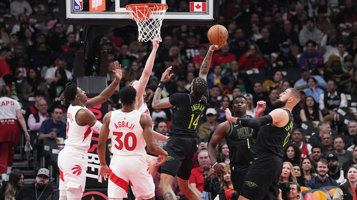 New Orleans Pelicans forward Brandon Ingram (14) drives to the basket over Toronto Raptors guard Ochai Agbaji (30) during the first quarter at Scotiabank Arena