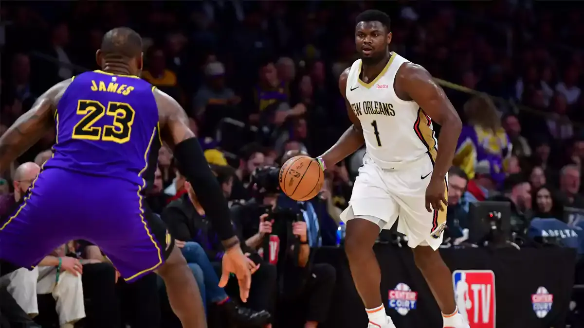 New Orleans Pelicans forward Zion Williamson (1) moves the ball up court against Los Angeles Lakers forward LeBron James (23) during the second half at Crypto.com Arena.