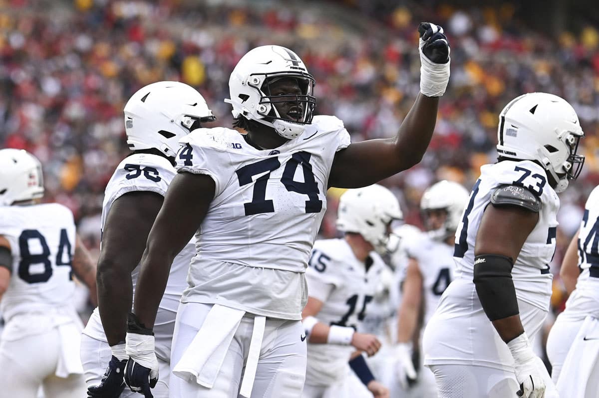 Penn State Nittany Lions offensive lineman Olumuyiwa Fashanu (74) celebrates after a first half touchdown against the Maryland Terrapins at SECU Stadium. 