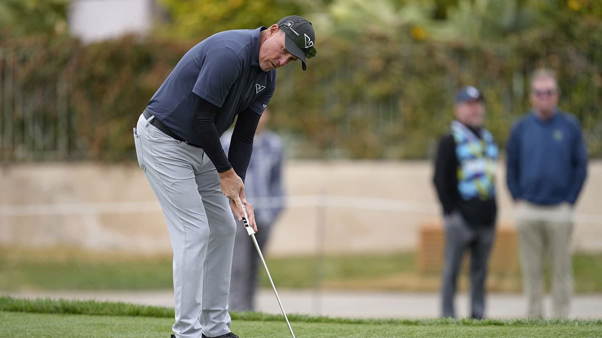 Phil Mickelson lines up his putt on the tenth green during the second round of the LIV Golf Las Vegas tournament at Las Vegas Country Club