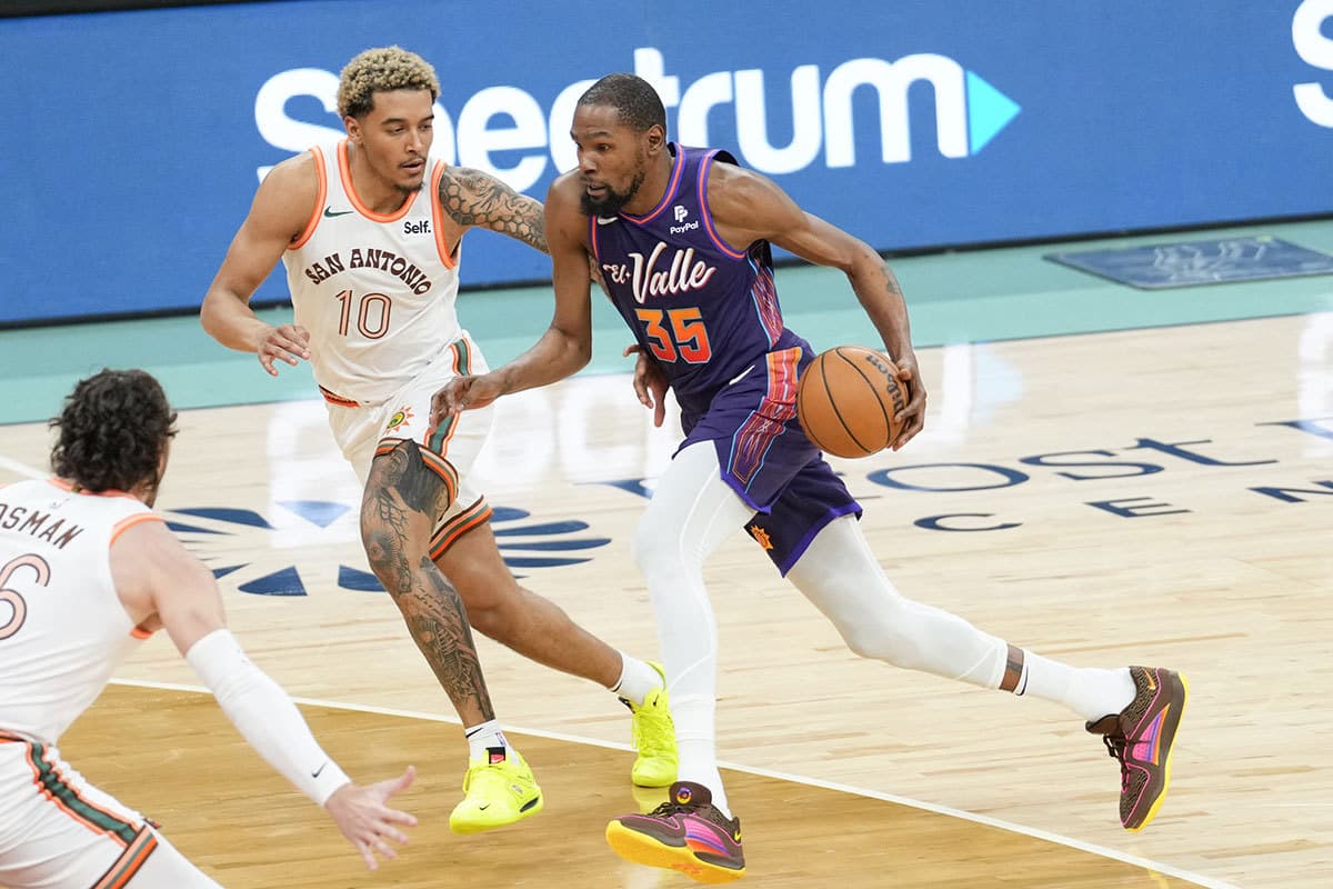 Phoenix Suns forward Kevin Durant (35) dribbles against San Antonio Spurs forward Jeremy Sochan (10) in the second half at Frost Bank Center. 