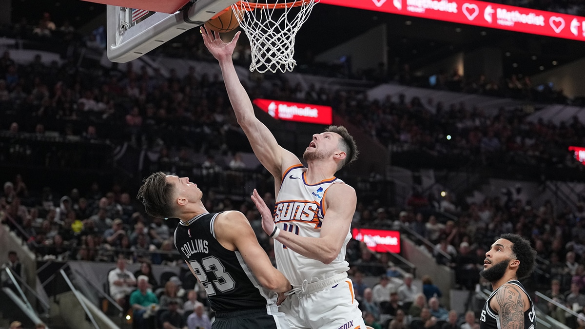 Phoenix Suns forward Drew Eubanks (14) shoots in front of San Antonio Spurs forward Zach Collins (23) in the second half at Frost Bank Center. 