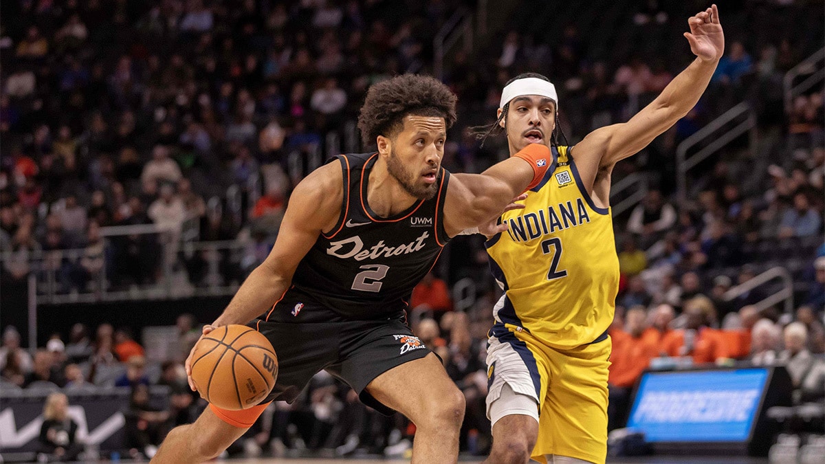 Detroit Pistons guard Cade Cunningham (2) drives to the basket next to Indiana Pacers guard Andrew Nembhard (2) in the first half at Little Caesars Arena.