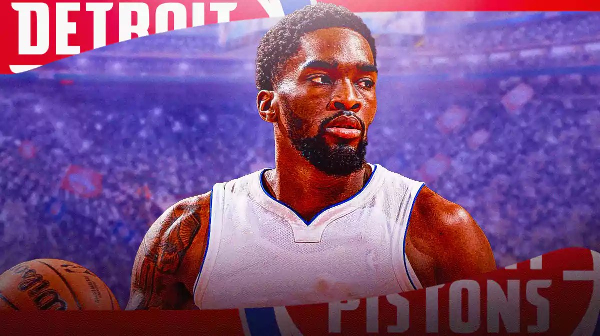 Shake Milton in a blank jersey with the Pistons arena in the background