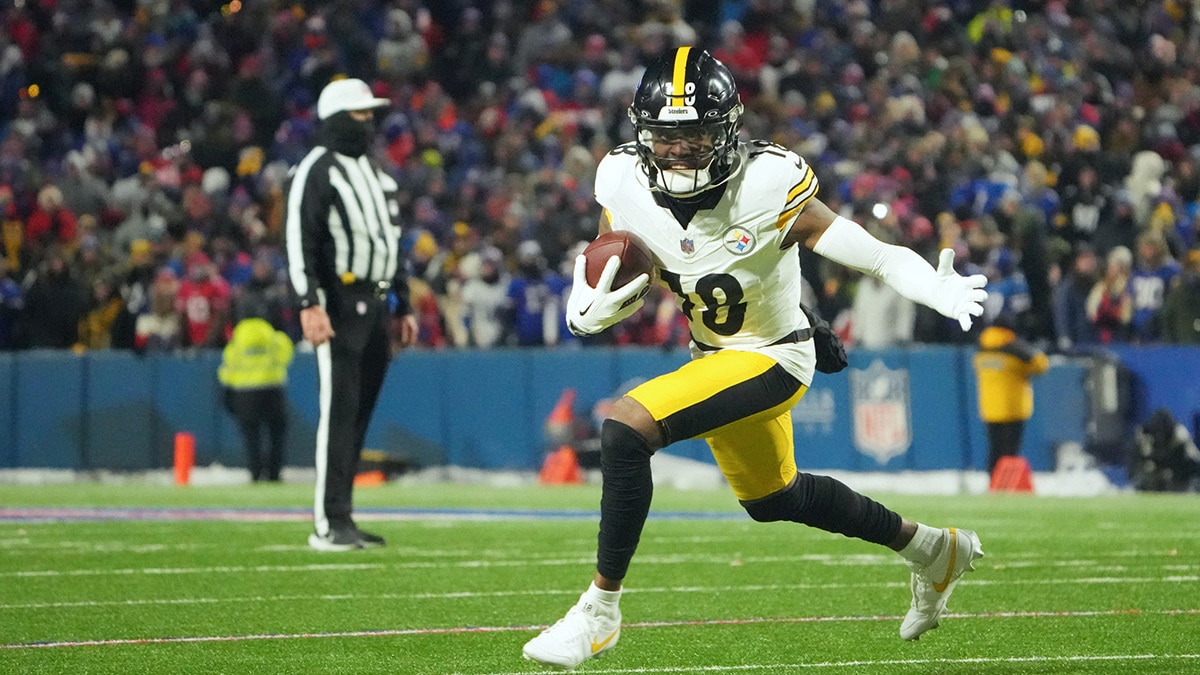 Pittsburgh Steelers wide receiver Diontae Johnson (18) runs the ball in the second half against the Buffalo Bills in a 2024 AFC wild card game at Highmark Stadium. 