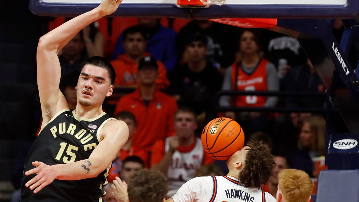 Purdue Boilermakers center Zach Edey (15) dunks the ball over Illinois Fighting Illini guard Niccolo Moretti (11), Illinois Fighting Illini forward Coleman Hawkins (33) and Illinois Fighting Illini guard Luke Goode (10) during the NCAA men s basketball game