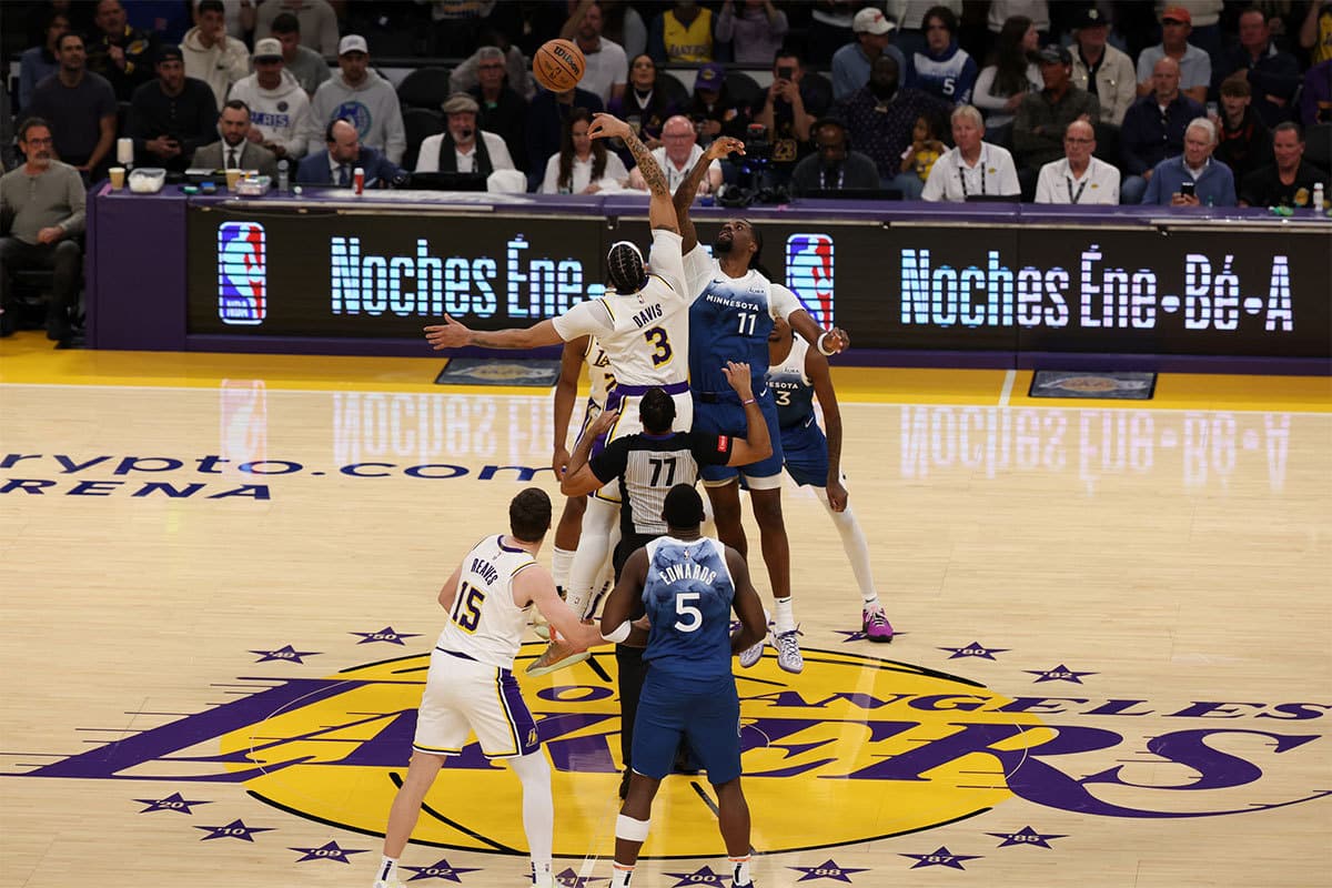 Los Angeles Lakers forward Anthony Davis (3) and Minnesota Timberwolves center Naz Reid (11) tip off during the first quarter at Crypto.com Arena. 