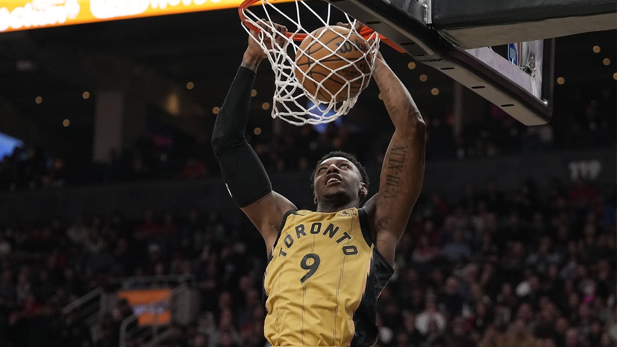 Toronto Raptors guard RJ Barrett (9) dunks the ball against the Golden State Warriors during the first half at Scotiabank Arena.