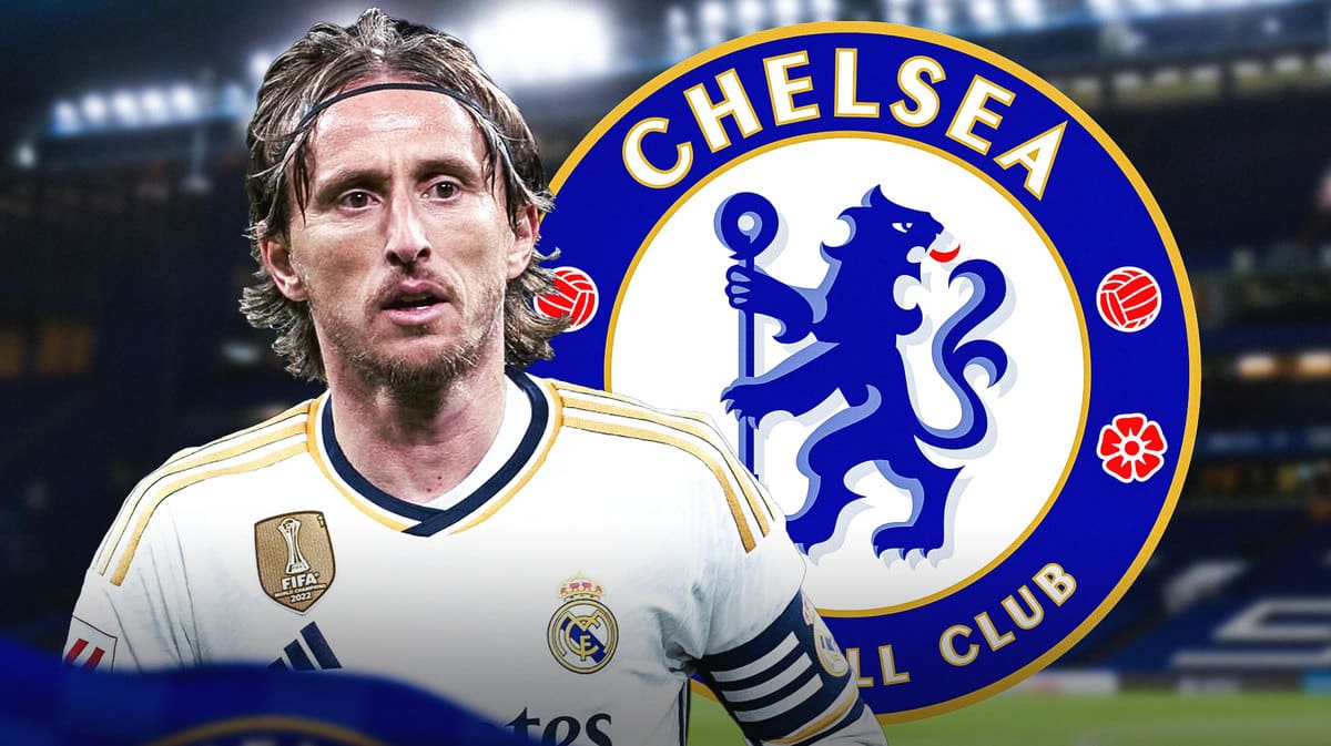 Luka Modric in front of the Chelsea logo