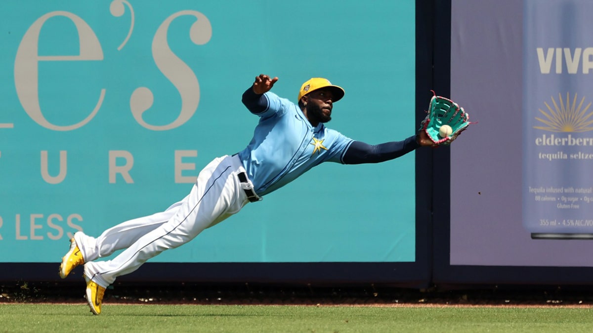 Randy Arozarena diving for a ball in the outfield on the Tampa Bay Rays