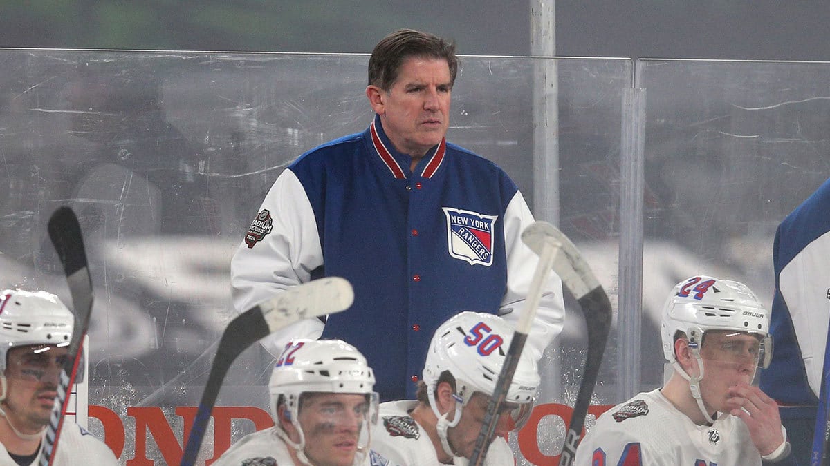 New York Rangers head coach Peter Laviolette coaches against the New York Islanders during the third period of a Stadium Series ice hockey game at MetLife Stadium.