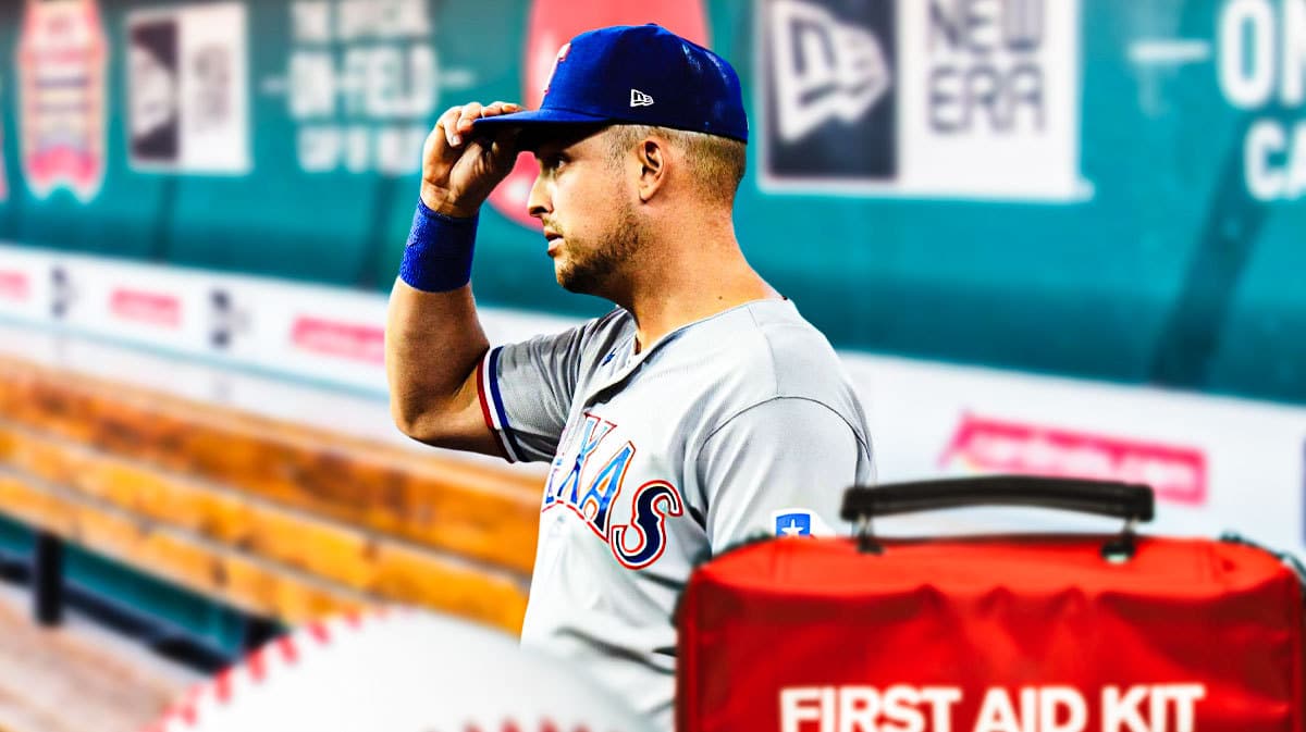 Rangers' Nathaniel Lowe sitting in an MLB dugout looking upset.