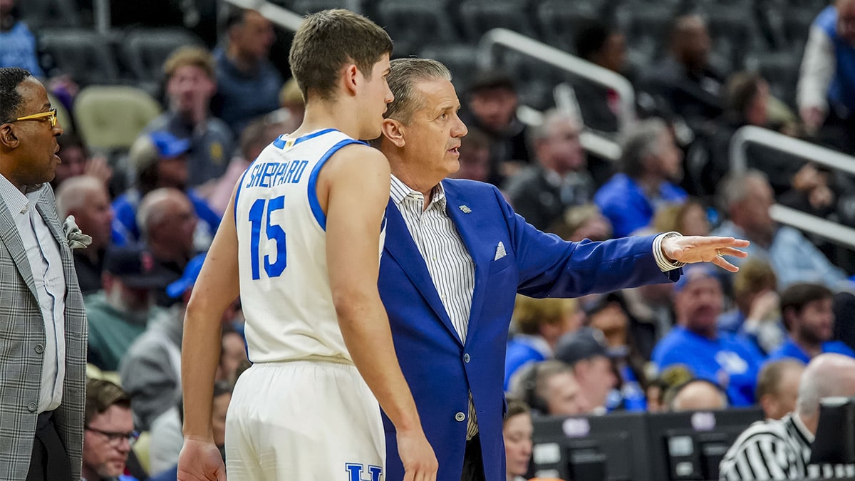 Kentucky Wildcats head coach John Calipari talks to Kentucky Wildcats guard Reed Sheppard (15) in the first round of the 2024 NCAA Tournament at PPG Paints Arena. 
