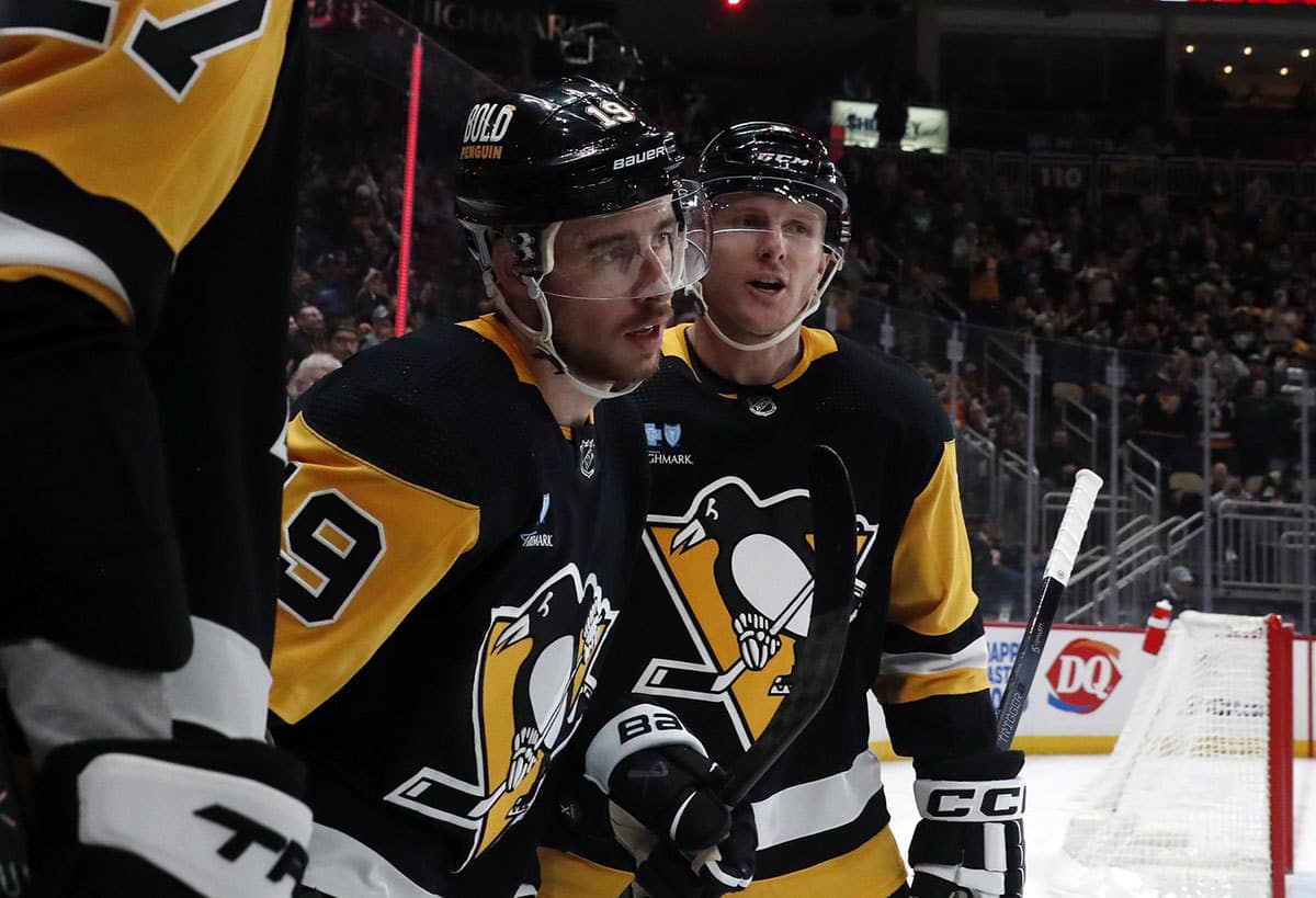 Pittsburgh Penguins right wing Reilly Smith (19) celebrates his goal with defenseman Chad Ruhwedel (right) against the Columbus Blue Jackets during the third period at PPG Paints Arena. The Penguins won 5-3.