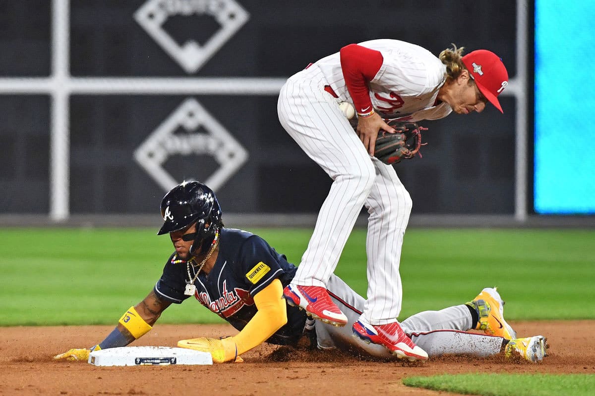 Atlanta Braves right fielder Ronald Acuna Jr. (13) steals second base against Philadelphia Phillies second baseman Bryson Stott (5) during the fifth inning in game three of the NLDS for the 2023 MLB playoffs at Citizens Bank Park