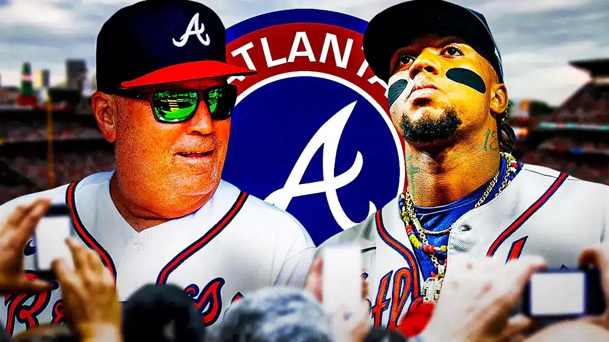 Brian Snitker and Ronald Acuna Jr in front of a Braves logo at Truist Park