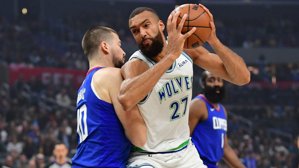 Minnesota Timberwolves center Rudy Gobert (27) moves to the basket against Los Angeles Clippers center Ivica Zubac (40) during the first half at Crypto.com Arena.