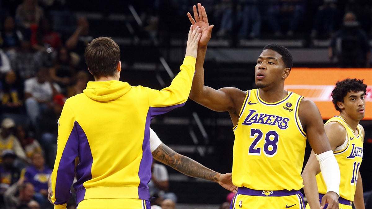 Los Angeles Lakers forward Rui Hachimura (28) reacts with guard Austin Reaves (15) during a time out during the first half against the Memphis Grizzlies at FedExForum.